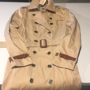 Woman’s Burberry trenchcoat